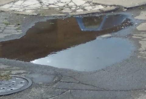 A puddle shaped like lower Michigan